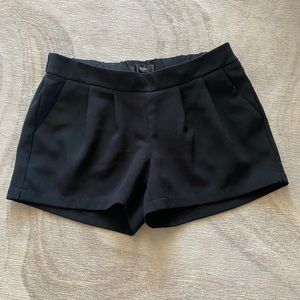 Black pleated shorts